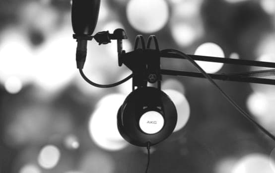 Person wearing headphones against geometric pattern