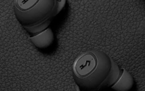 Person wearing headphones against geometric pattern